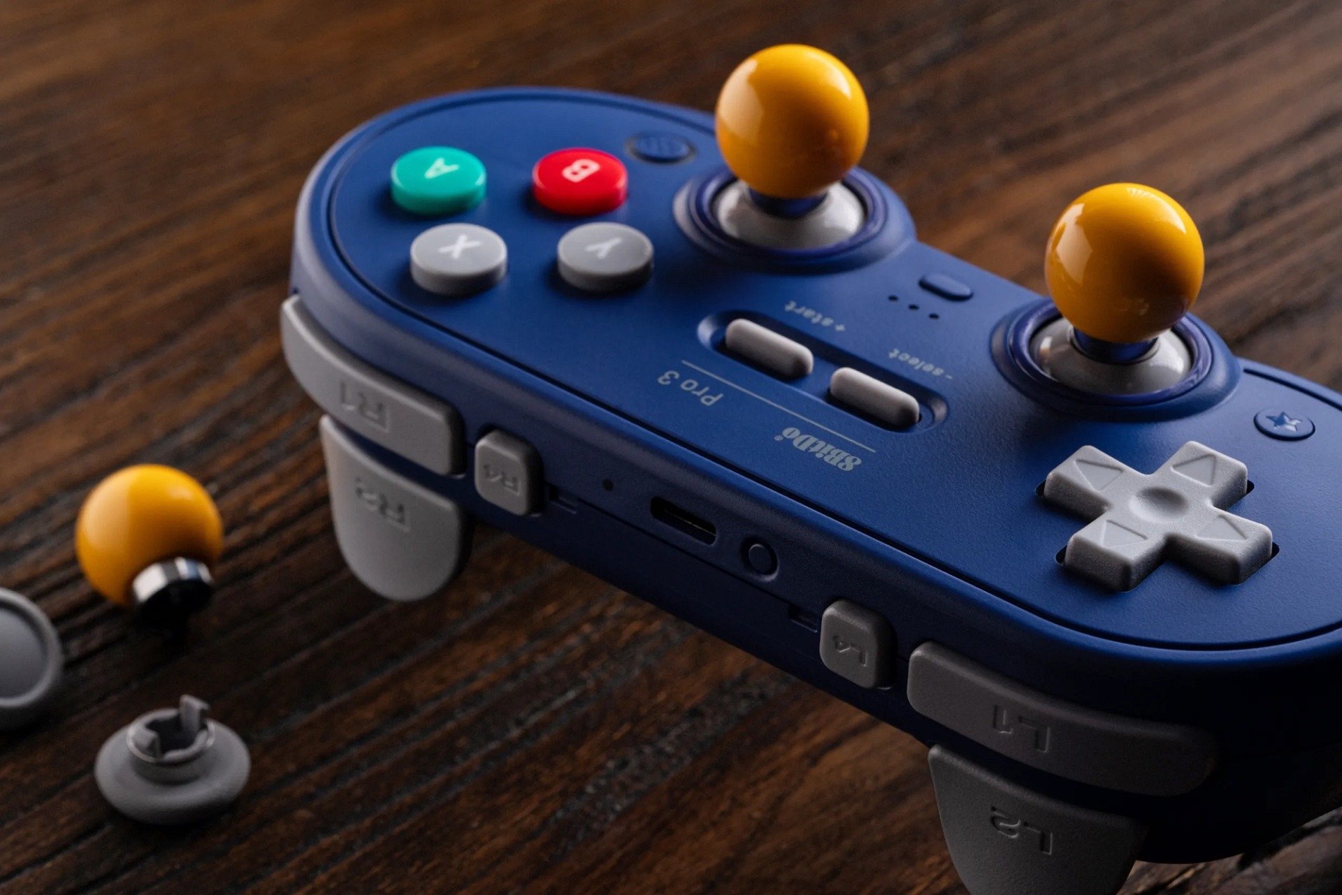 8bitdo Pro appears on wood. 